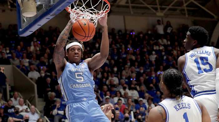 North Carolina forward Armando Bacot (5) dunks as Duke guard Trevor Keels (1) and center Mark Williams (15) watch during the first half of an NCAA college basketball game Saturday, March 5, 2022, in Durham, N.C.
